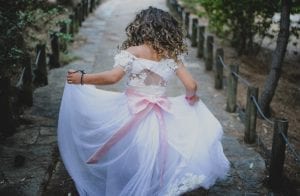daughter dressed as flower girl